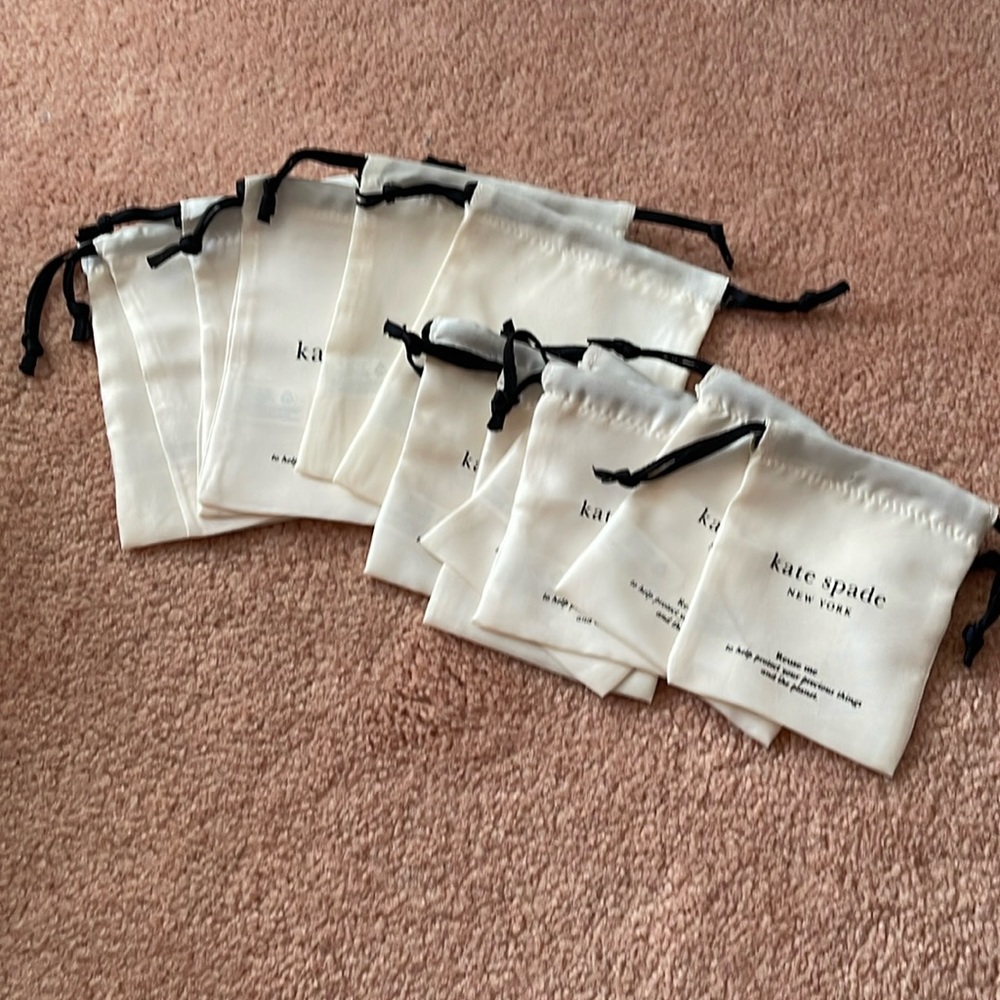 Kate spade’s (12) brand new  satin pouches